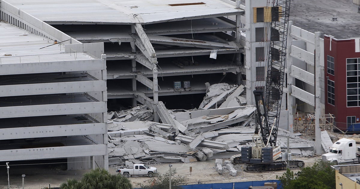 Worker freed from rubble of parking garage collapse CBS News