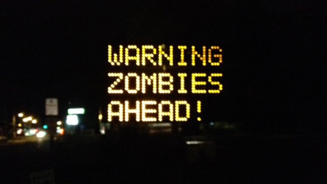 A sign at a road construction site was changed by a hacker to read "Warning Zombies Ahead!" in Portland, Maine, Wednesday, Oct. 10, 2012.  