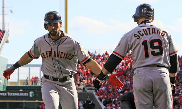 Angel Pagan is congratulated by Marco Scutaro 
