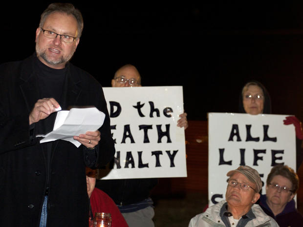 Reynold Nesiba, a death-penalty opponent, speaks to a crowd of protesters outside the South Dakota Penitentiary in Sioux Falls, S.D., on Monday, Oct. 15, 2012, in anticipation of the execution of Eric Robert. Robert pleaded guilty in the April 12, 2011, slaying of a guard during a failed prison escape and asked to be put to death, saying he would kill again. He was scheduled to die by lethal injection at 10 p.m. at the State Penitentiary in Sioux Falls_ the state's first execution in five years and only the second in more than half a century. 