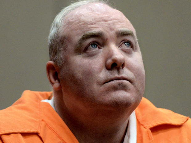 Michael Skakel looks up while listening to a statement from John Moxley, unseen, brother of victim Martha Moxley, in court in Middletown, Conn., Jan. 24, 2012. 
