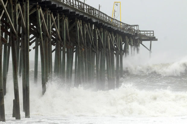 Waves pound Carolina Beach pier in Carolina Beach, N.C., Saturday, Oct 27, 2012, as Hurricane Sandy churns in the Atlantic Ocean. 