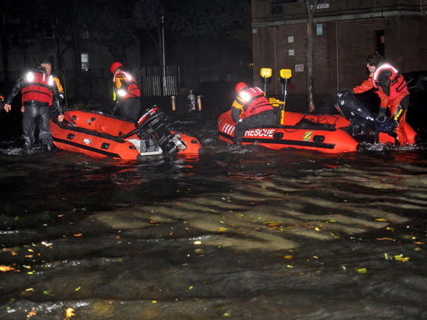 Inflatable boats from the New York Fire Department travel along 14th Street toward the East River on a rescue mission in the wake of Hurricane Sandy Oct. 29, 2012, in New York. 