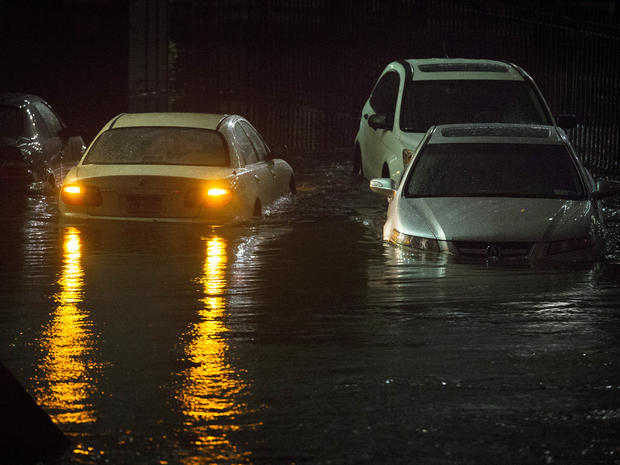 Vehicles are submerged during a storm surge near the Brooklyn Battery Tunnel, Monday, Oct. 29, 2012, in New York. 