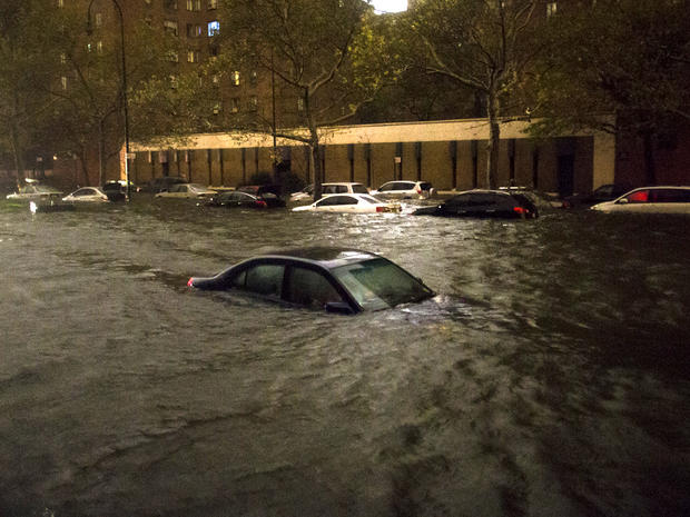 A vehicle is submerged on 14th Street near the Consolidated Edison power plant Oct. 29, 2012, in New York. 