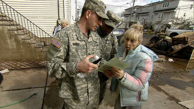 Rescue workers searching homes for Sandy victims 