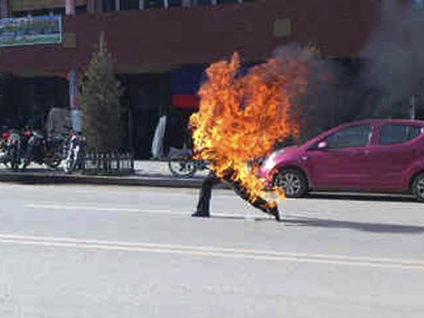 Tibetan farmer runs after self-immolating in northwestern China's Gansu province 