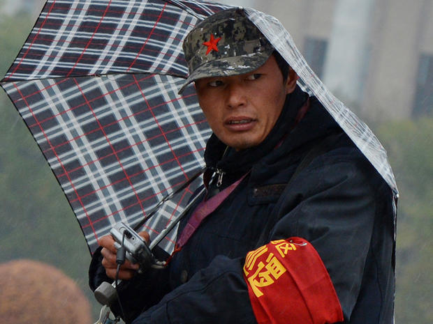 A man working as a security volunteer in Tiananmen Square 
