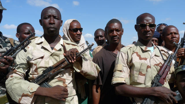 Some 300 Malian civilians receive military training from an army instructor on August 20, 2012 