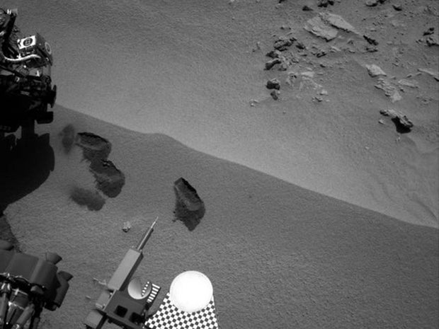 Three bite marks left in the Martian ground by the scoop on the robotic arm of NASA's Mars rover Curiosity are visible in this image taken by the rover's right Navigation Camera during the mission's 69th Martian day, or sol (Oct. 15, 2012).