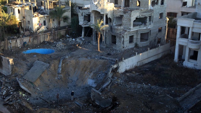 A crater seen a a site targeted by an Israeli air strike in Gaza City  