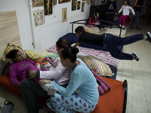 Israelis prepare to spend the night in a shelter in the southern Israeli town of Netivot 