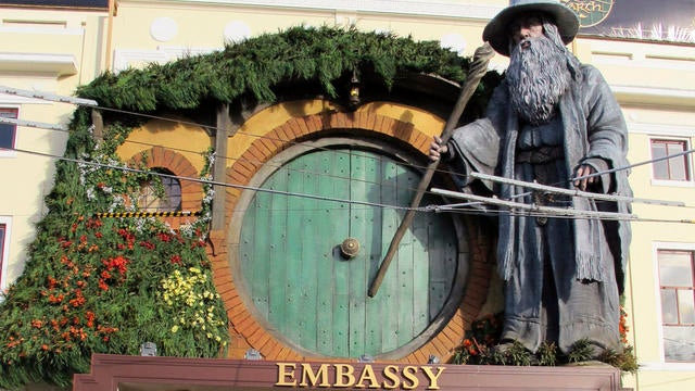 Image shows top of Embassy Theater, where giant statue of character Gandalf from upcoming movie "The Hobbit: An Unexpected Journey" overlooks passersby in Wellington, New Zealand Nov. 19, 2012 