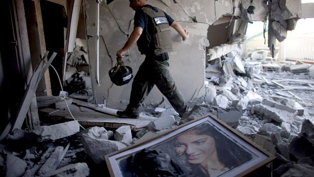  A bomb disposal officer at a house after it was hit by a rocket fired from the Gaza Strip on November 20, 2012 in Beersheba, Israel.  