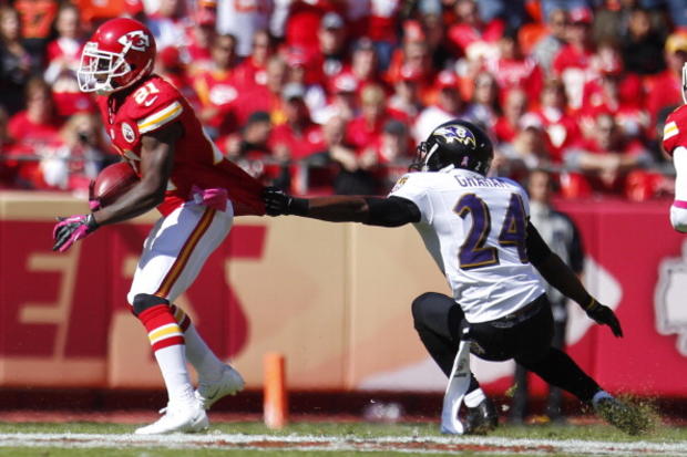 Corey Graham attempts to take down down Javier Arenas of the Kansas City Chiefs 