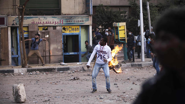  	Stones litter the street as protesters face Egyptian riot Police during clashes on Omar Makram street, off Tahrir Square, on November 28, 2012 in Cairo. 