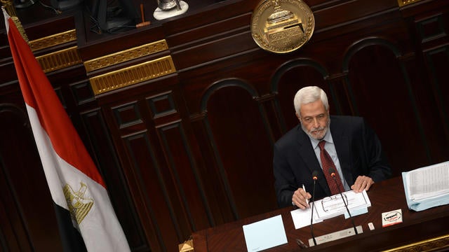 Judge Hossam El-Gheriany, chairman of the constituent assembly, looks on as members of Egypt's constituent assembly discuss of the last voting session on a new draft constitution at the Shoura Assembly on November 29, 2012 in Cairo. 