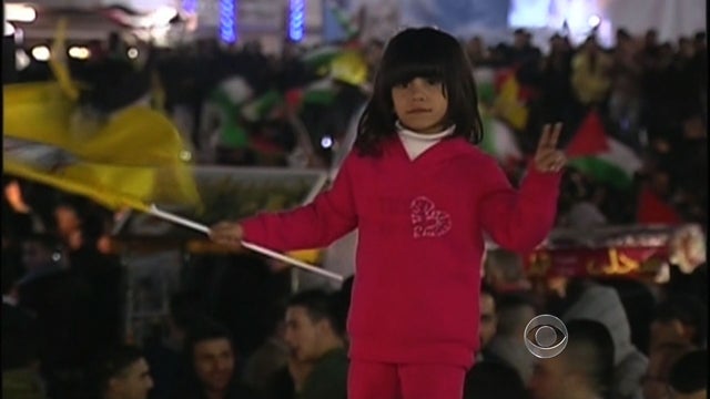 A Palestinian child celebrates the U.N.'s vote in Ramallah, in the West Bank. 