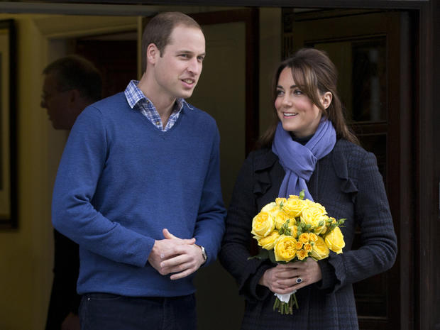 Britain's Prince William stands next to his wife Kate, Duchess of Cambridge as she leaves the King Edward VII hospital in central London, Thursday, Dec. 6, 2012. Prince William and his wife Kate are expecting their first child, and the Duchess of Cambridg 