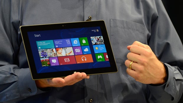 Microsoft CEO Steve Ballmer holds a Surface tablet on June 18, 2012, in Los Angeles. 