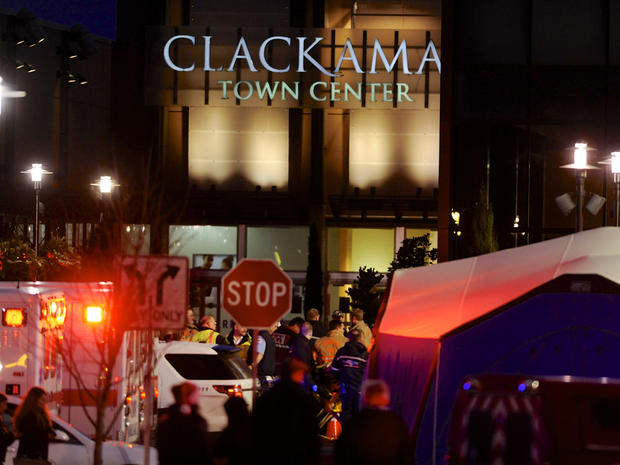 Police and medics work the scene of a multiple shooting at Clackamas Town Center Mall in Clackamas, Ore., Tuesday Dec. 11, 2012. A gunman is dead after opening fire in the Portland, Ore., area shopping mall Tuesday, killing two people and wounding another 