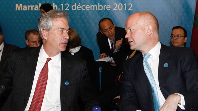 U.S. Deputy Secretary of State William J. Burns, left, chats with Britain's Foreign Minister William Hague 