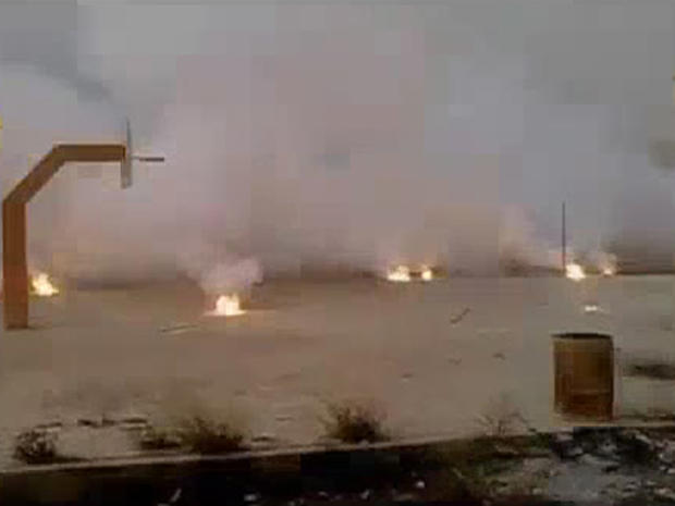 Allged incendiary bomb submunitions burn on the ground in Syria 