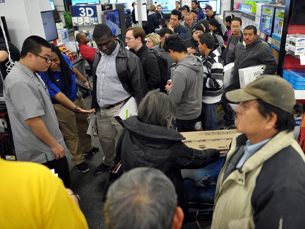 Shoppers are seen inside a Best Buy store that began its Black Friday sale at midnight Thanksgiving Day, Nov. 22, 2012, in Rockville, Md. 