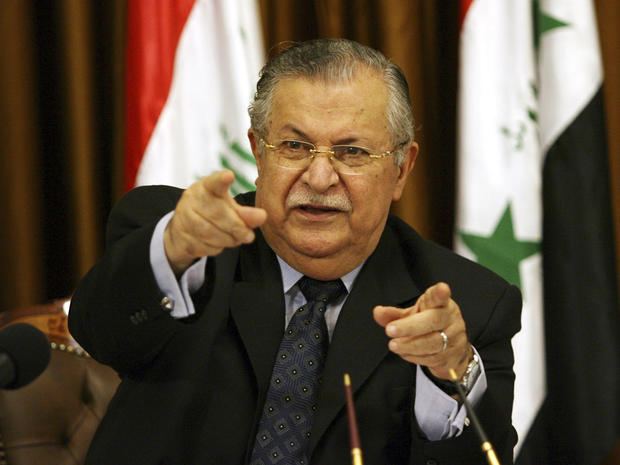 In this Aug 17, 2007 file photo, Iraq's President Jalal Talabani talks to reporters in Baghdad, Iraq. The office of Iraqi President Jalal Talabani said Tuesday he has been admitted to the hospital for treatment of an unspecified health problem. 