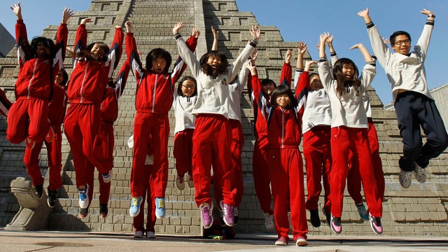 Students react during countdown to when many believe Mayan people predicted as end of the world, Friday, Dec. 21, 2012, in Taichung, southern Taiwan 