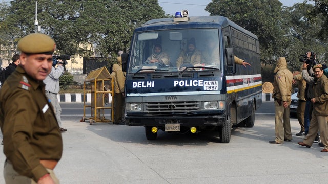 Van believed to be carrying India gang-rape suspects into court  