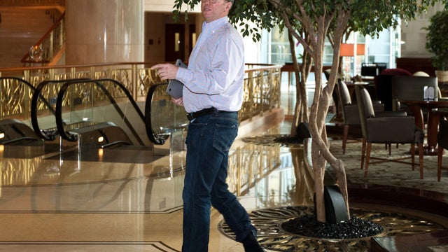 Google's executive chairman Eric Schmidt walks away from a hotel lounge after a meeting with former New Mexico Gov. Bill Richardson in Beijing Monday, Jan. 7, 2013. Schmidt, who is part of a delegation led by Richardson, is scheduled to leave Monday on a  