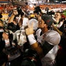 AJ McCarron, of Alabama, celebrates with Coach's Trophy after Crimson Tide beat Notre Dame, 42-14, to win BCS title in Sun Life Stadium in Miami Gardens, Fla.on January 7, 2013  