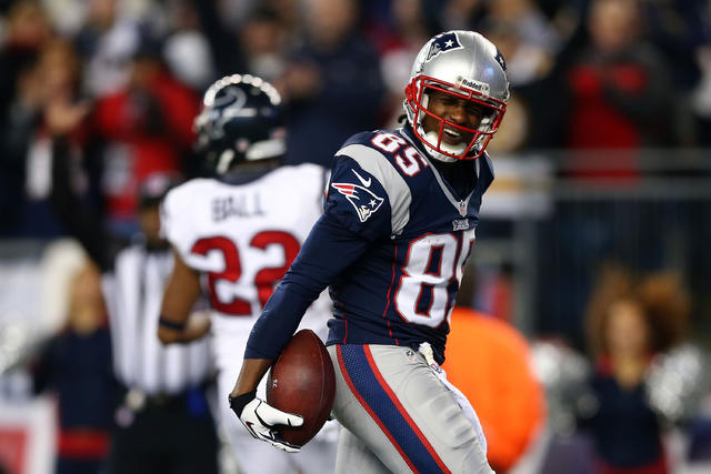 New England Patriots wide receiver Brandon Lloyd (85) celebrates his  touchdown pass with tight end Aaron Hernandez (81) during the first quarter  of an NFL football game against the Houston Texans in