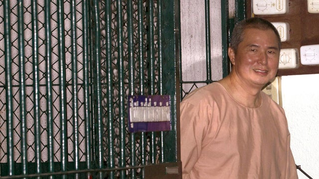 Activist Somyot Pruksakasemsuk walks to a court room at criminal court in Bangkok, Thailand Wednesday, Jan. 23, 2013. The court has sentenced the prominent labor rights activist and magazine editor to 10 years in prison for publishing a pair of articles p 