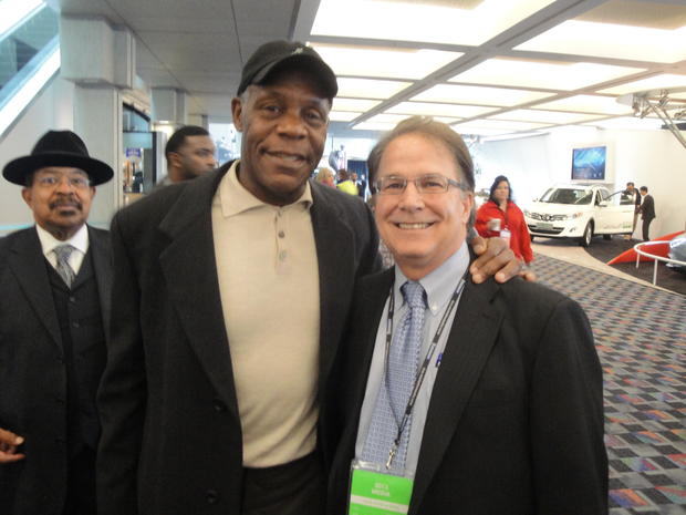Danny Glover and Tom Watkins, President and CEO of TDW and Associates, pose for a picture 