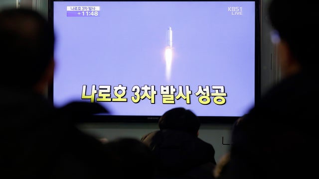 South Koreans watch a television broadcast reporting the country's first rocket launch at Seoul Railway Station in Seoul, South Korea, Wednesday, Jan. 30, 2013. South Korea has launched a rocket in its third attempt to place a satellite in space from its  