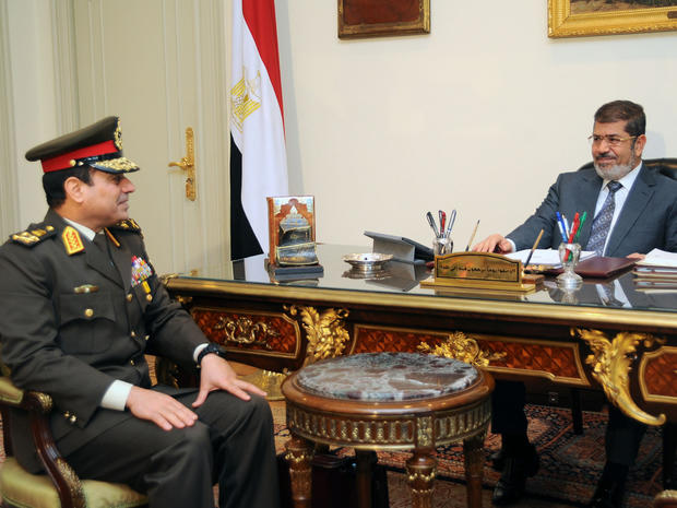 President Mohammed Morsi, right, meets Lt. Abdul Fattah El-Sissi 