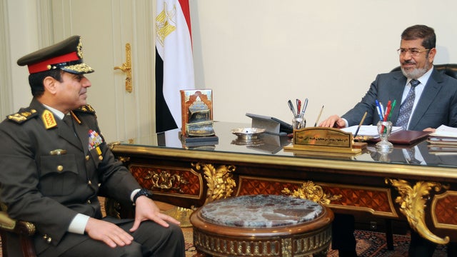President Mohammed Morsi, right, meets Lt. Abdul Fattah El-Sissi 