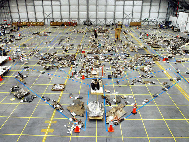 In this NASA handout, Columbia Space Shuttle debris lies floor of the RLV Hangar May 15, 2003 at Kennedy Space Center, Florida. The Columbia Accident Investigation Board investigators say that a culture of low funding, strict scheduling and an eroded safety program at NASA doomed the flight of the space shuttle. (Photo by NASA/Getty Images) 