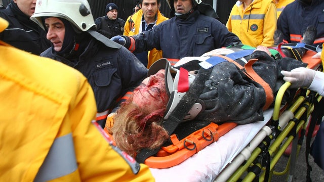 Rescuers move a victim of a blast outside the U.S. Embassy in Ankara, Turkey, to a waiting ambulance Feb. 1, 2013. 