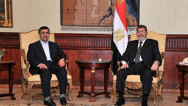 Ahmadinejad and Morsi pose in Cairo. 