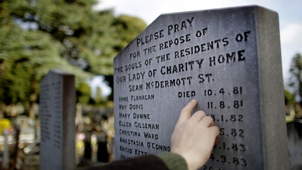 man looks at a burial plot for victims of the Magdalene Laundries in Glasnevin Cemetery, Dublin on the eve of the report to investigate the states role in the laundries which was compiled by a committee of officials from five Government departments and c 
