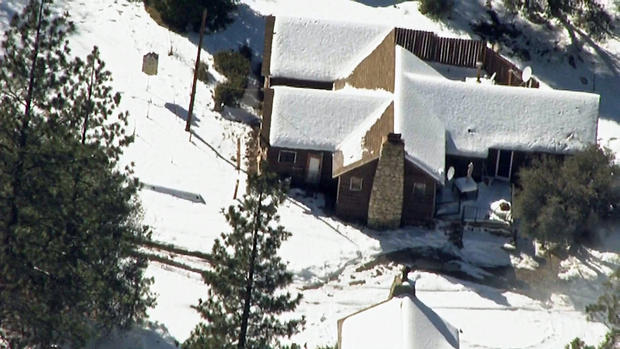 Ex-cop holed up in cabin near sheriff's command center 