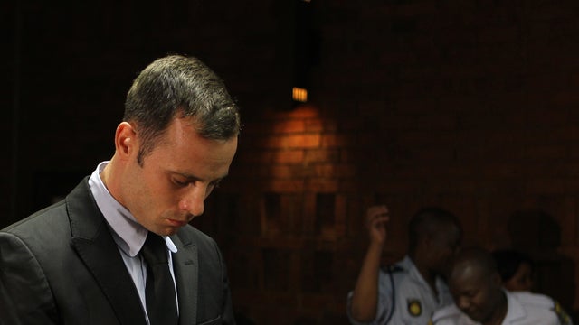 Oscar Pistorius stands in court during his bail hearing  