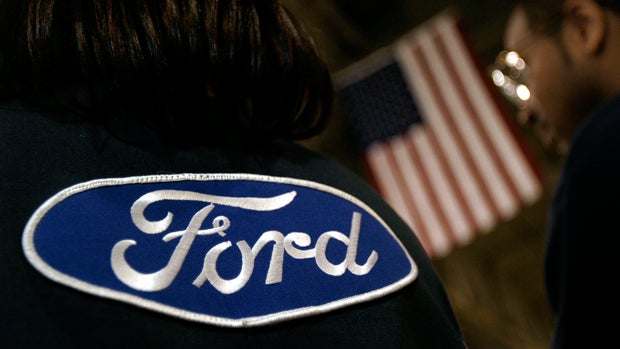 Employees attend the reopening of Ford's Cleveland Engine Plant on May 11, 2004 
