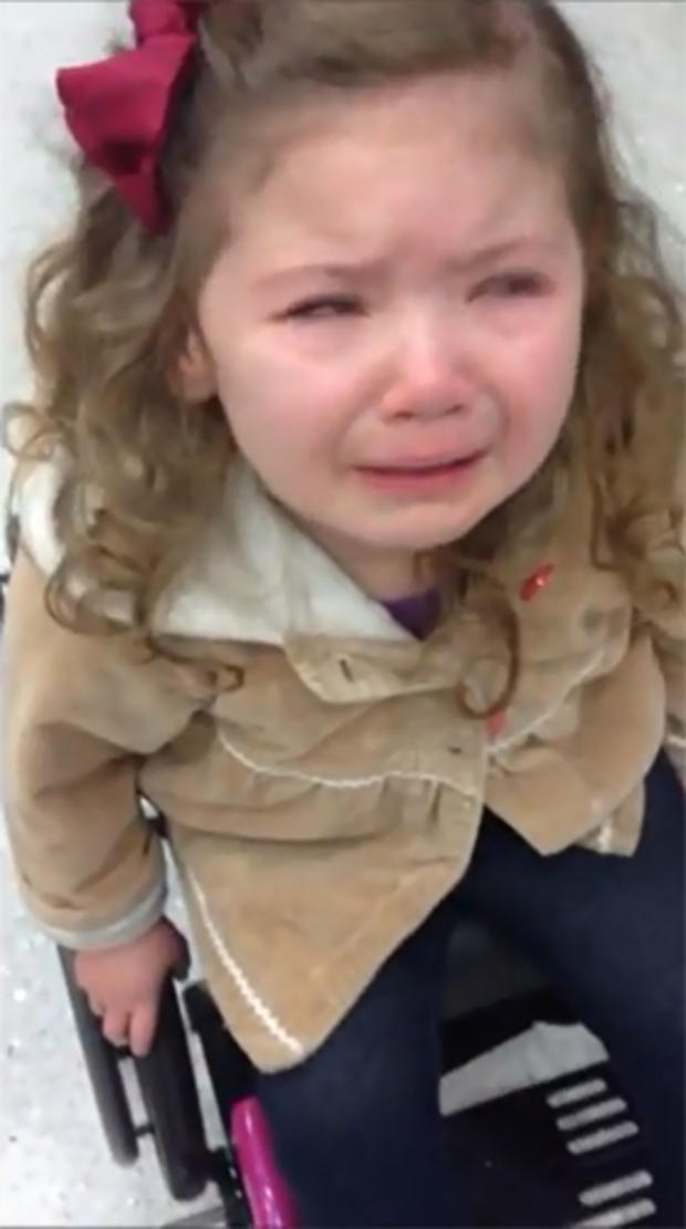 Lucy, 3, cries during a TSA security checkpoint at Lambert airport in St. Louis 