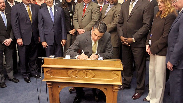 Nevada Gov. Brian Sandoval signs Assembly Bill 114, the online gaming bill, on Feb. 21, 2013 
