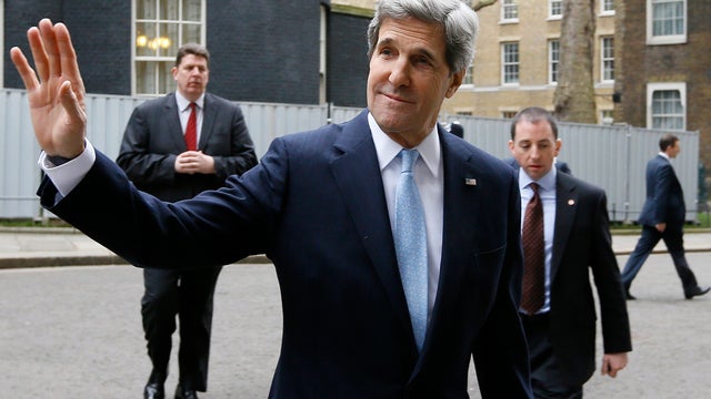 U.S. Secretary of State John Kerry waves to the media as he leaves Downing Street in London, Monday, Feb. 25, 2013. Kerry kicked off his first official overseas trip by meeting with British leaders in London on the first leg of a hectic nine-day dash thro 