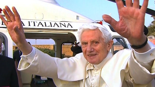 Pope Benedict XVI waves to clergy and supporters as he departs the Vatican for the final time as pontiff, Feb. 28, 2011. 
